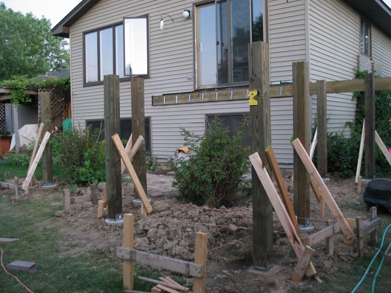 Posts go up
Once the footings were in place, we could finally start building up.  Here, all seven posts are in place and temporarilly supported.
