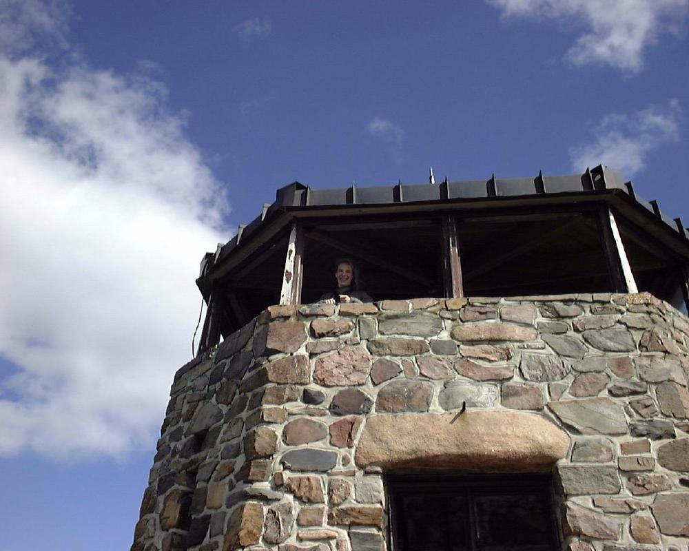Cathy at the Summit
Cathy stands in the lookout tower on Harney Peak.  The view, particularly of the adjacent Needles formations, made it well worth the six-mile climb.
