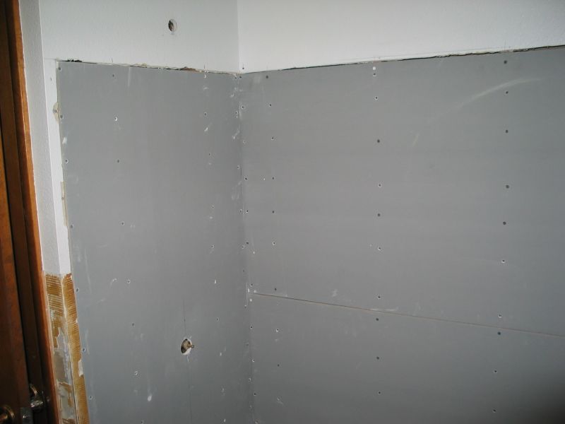 During:  Tub area
And still another picture.  The hole above the gray underlayment is where the shower head will attach.
