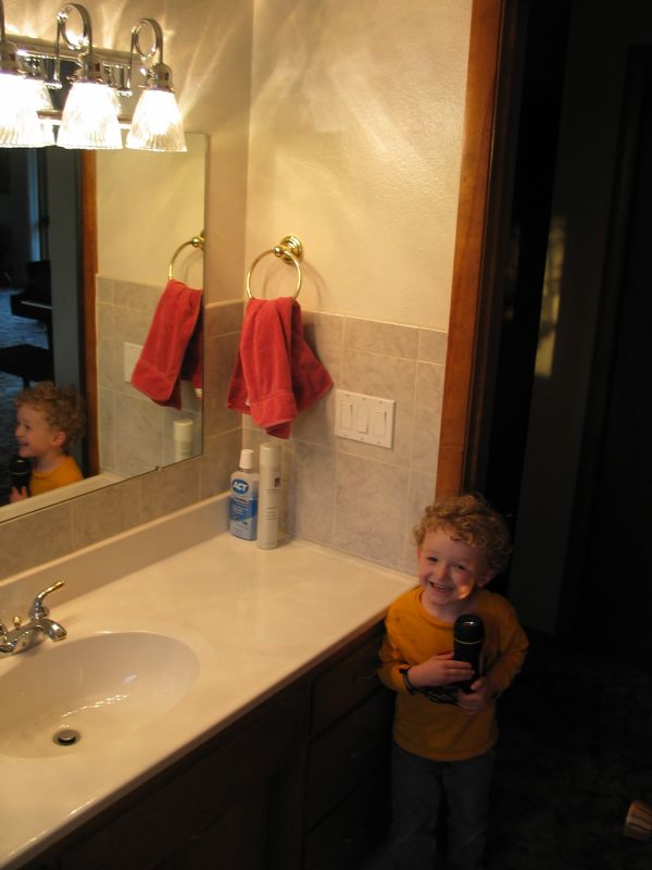 William shows off the room
William decides to play with a flashlight in Grandma's new bathroom.
