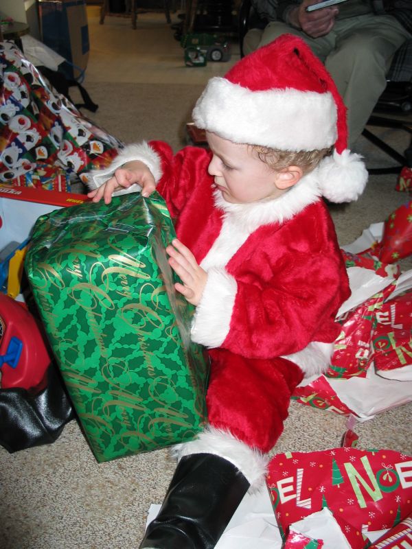Opening green present
Santa-William opens a present.
