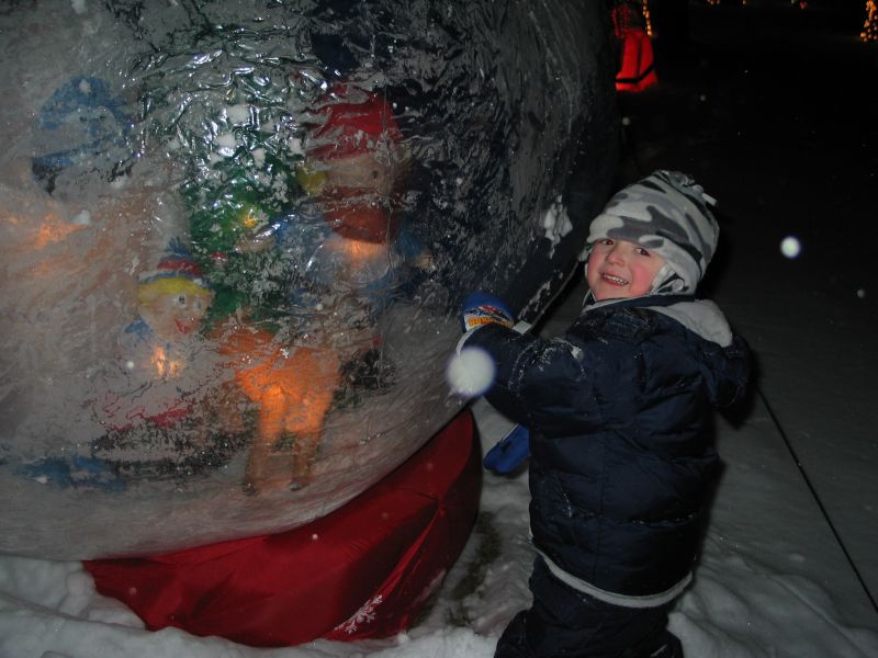 Snow Globe
William checks out the snow globe.  You can barely tell but inside are Rudolph, Yukon, Hermie, and the Bumble.  The globe was really frosted up most of the season and although I like it I'm wondering if it's worth using again (this was our first year with it).
