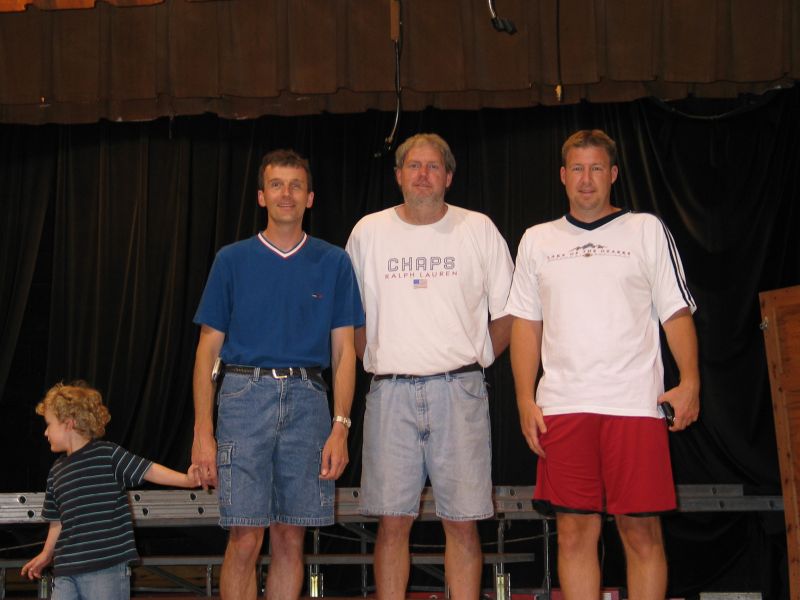 On Stage
Tim, with cousins Loren and Tony Heitland (who also attended M-T), as well as William, stand on the stage at the former M-T high school.
