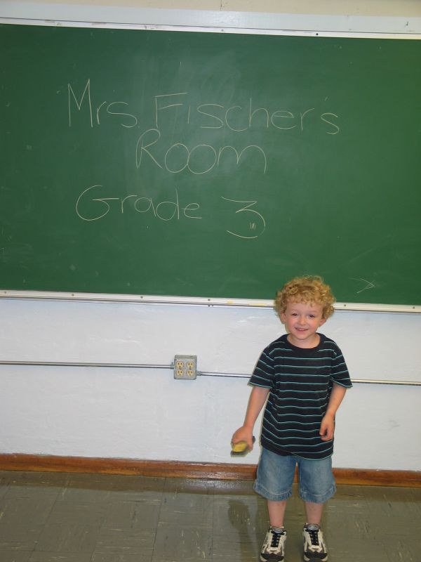 Mrs. Fischer's room
William stands by the blackboard where Cathy wrote "Mrs. Fischer's Room"
