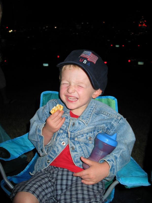 Fire(works) Cracker
William munches on a cracker while waiting for the Fireworks to start.
