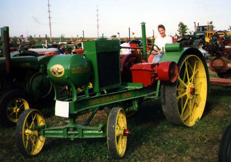 Waterloo Boy
The Waterloo Boy is considered the first John Deere tractor, even though it didn't have their brand on it.  Here Cathy poses by this beautifully restored piece.
