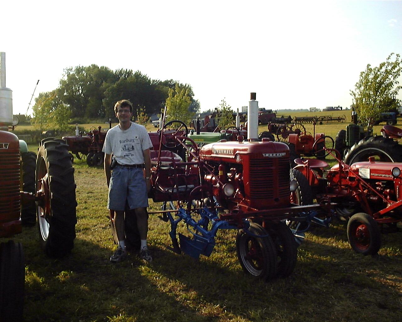 Tim & Farmall?
Cathy didn't think she could talk Tim into posing with this International FarmAll, but he did it anyway (with the disclaimer that the Deere's are much cooler!)
