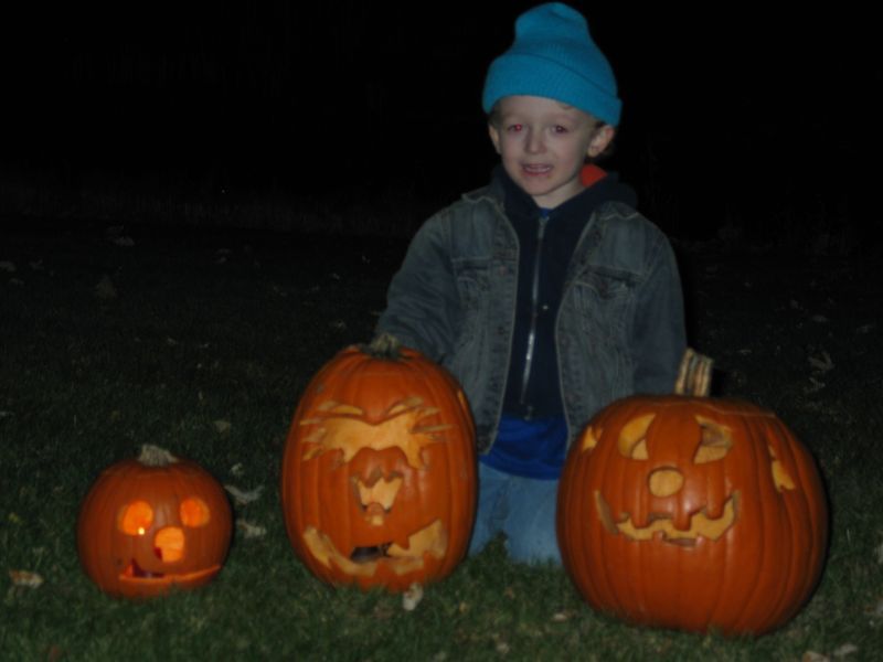 William poses with the pumpkins
