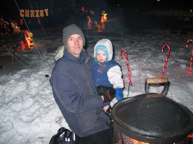 Daddy and Andrew warm up by the fire
