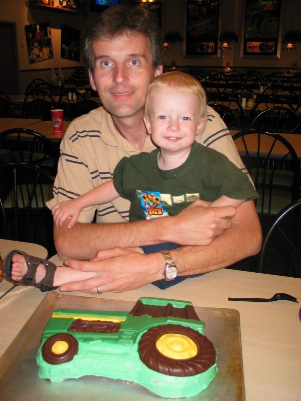 Dad and Andrew with Tractor Cake
The Tractor Cake gets a lot of mileage in our family (which, if you've looked at our previous birthday galleries, you'll see proof of!)  But the boys both love it...  William's already requested it (again) for his birthday in September...
