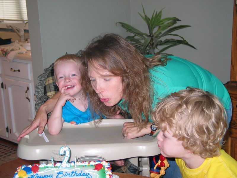 Mommy helps blow  out the candles...
