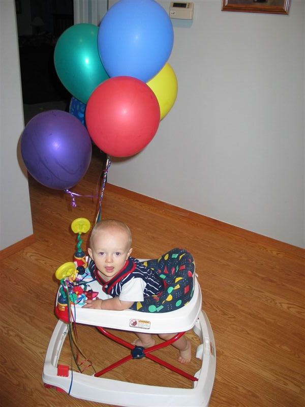 Hood Ornament
Not quite able to walk yet, William scoots around in his walker with some colorful balloons.
