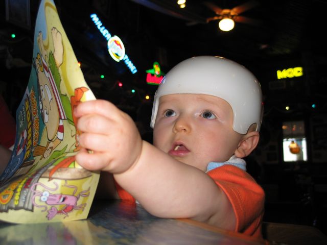 Joe's Crab Shack
For Daddy's birthday (June 5), the three of us went to Joe's Crab Shack (where William enjoyed some carried-in baby-food, and Mom and Dad enjoyed some wonderful shrimp).  The helmet is a CranioCap which he wore for a couple months to help round out his head.

