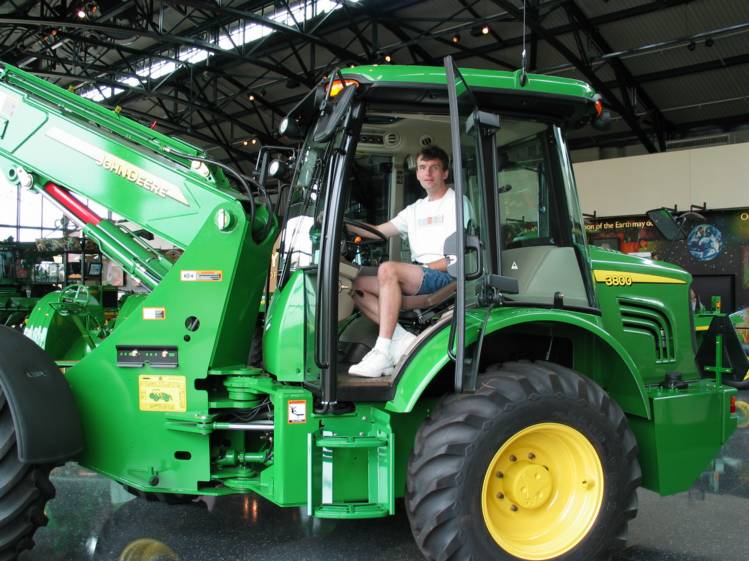 Tim with Deere 3800
Here Tim tries out the cab of one of the newer tractors inside the Pavilion.    
