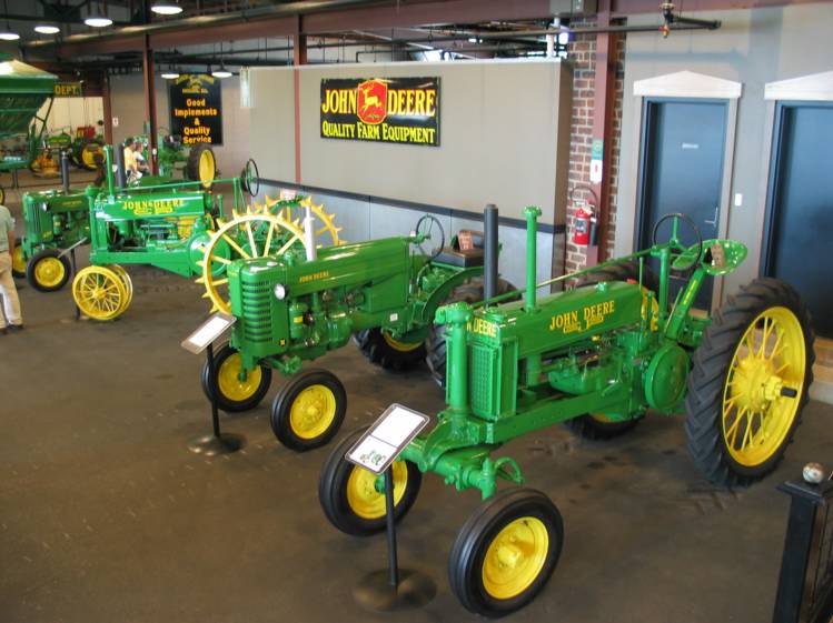 John Deere Collectors Center
More beautifully restored tractors at the Collectors Center.  There were also some old John Deere signs on the walls as you can see in this picture.
