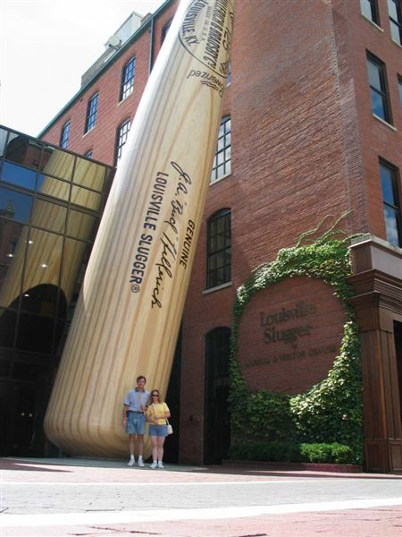 Louisville Slugger Factory
Our next stop was the Louisville Slugger Factory and Museum.  Here is where they make the world-famous wooden bats.  We went on the tour, and got to take home a 'mini-bat' as well.  Outside the factory is a huge bat, which we posed with here.
