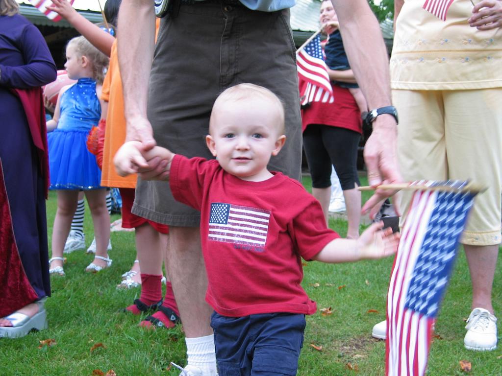 Fly the Flag!
William carries a flag (and wears one too) in the Meservey, IA Kiddie Parade.  

