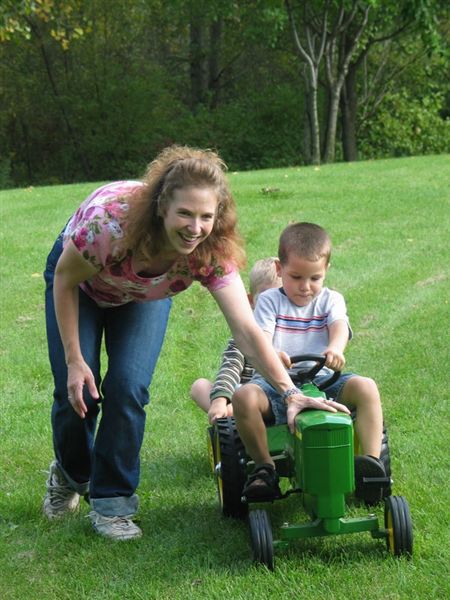 Helping out
Cathy helps Grant and Matthew with the tractor.
